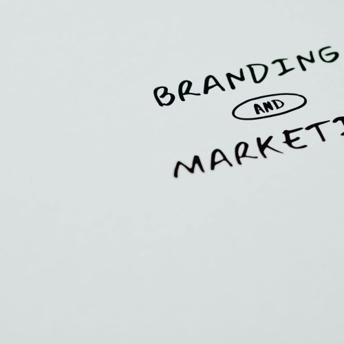 A minimalist image featuring the words 'Branding' and 'Marketing' on a white background, ideal for digital marketing themes.